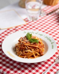 Italian Cuisine: Pizza and Pasta Dishes in a Cozy Restaurant Setting 