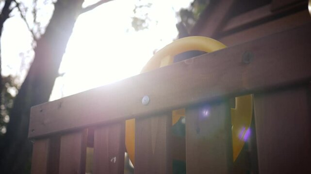 Kids Tree House Series - 7 - Sunlight over steering wheel on playhouse