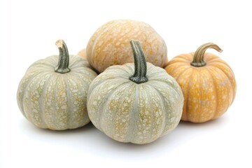 Fototapeta premium A trio of pumpkins arranged on a white background, great for fall-themed designs and illustrations