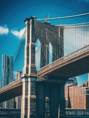 Fototapeta premium A close-up view of the Brooklyn Bridge showcasing its architectural details and city backdrop.