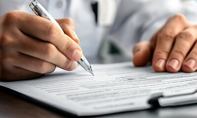 Hand writing on a document with a pen. - Powered by Adobe