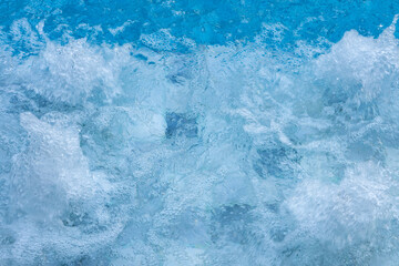 Blue Water Pool Surface with Sunlight Reflections