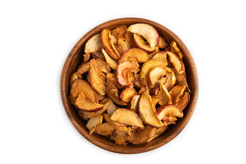 Obraz premium Dried Apples in wooden bowl isolated on white. Top view, close up