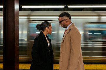 Businesspeople having disagreement on subway platform