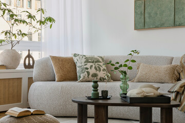Inviting sofa setting with earthy pillows, green accents, and a rustic coffee table, perfect for...