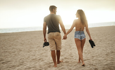Back, holding hands and couple at beach for love, care and connection together with slippers....