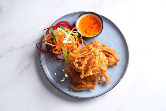 Deep fried enoki mushrooms served with salad crunch and sweet chili sauce.