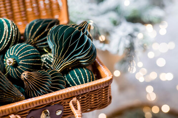 The banner. Stylish paper and velvet Christmas tree toys in Scandinavian style in a wicker...