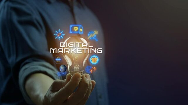 Businessman showing glowing neon line of digital marketing concept with icons of branding, advertising, SEO, social media, devices, internet and target on virtual screen.