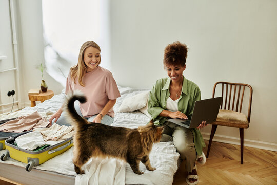 Couple happily prepares for their upcoming journey, sharing laughter and moments.