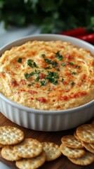 Cheesy pimento dip with crackers.