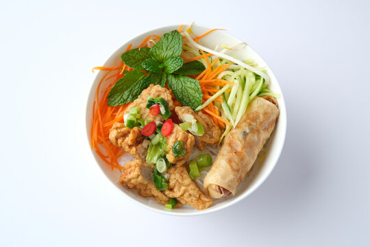 Bun Cha Gio bowl topped with fried spring roll and Cha Lua.