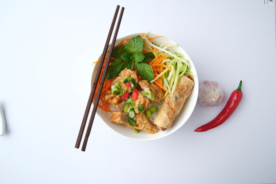 Bun Cha Gio bowl topped with fried spring roll and Cha Lua.