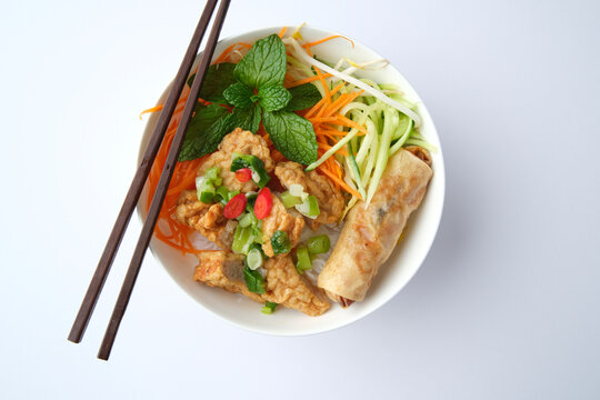 Bun Cha Gio bowl topped with fried spring roll and Cha Lua.