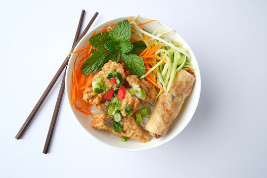 Bun Cha Gio bowl topped with fried spring roll and Cha Lua.