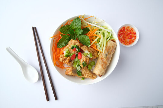 Bun Cha Gio bowl topped with fried spring roll and Cha Lua.