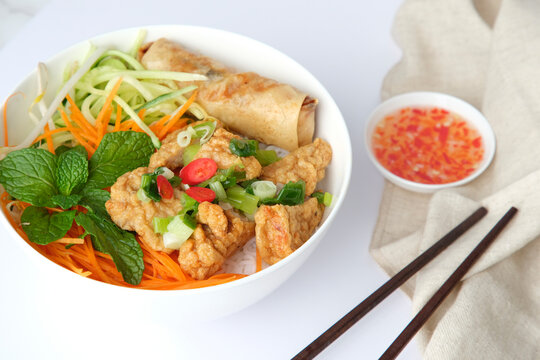 Bun Cha Gio bowl topped with fried spring roll and Cha Lua.