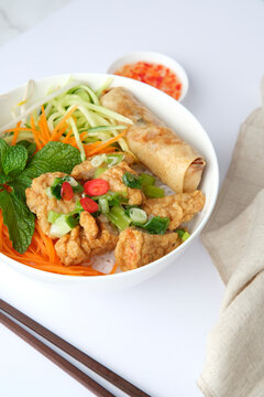 Bun Cha Gio bowl topped with fried spring roll and Cha Lua.