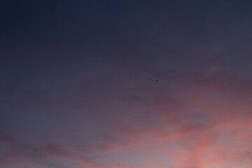 Pink, Purple , Pastel sunset sky Background in the evening after sun down with colorful sunlight on Dusk sky clouds