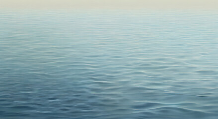 Obraz premium A smooth water surface with gentle, layered ripples, creating a calm background with natural texture and open space.