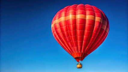 Fototapeta premium Red hot air balloon against bright blue sky