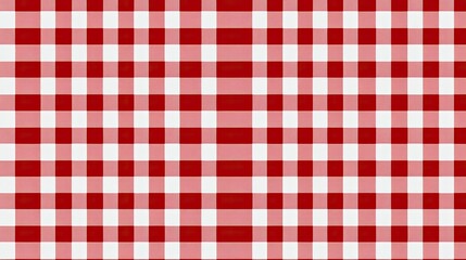 Red checkered tablecloth spread out on a plain white background, offering a warm and welcoming visual for kitchen or picnic themes.