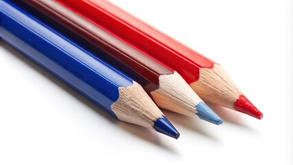 Red white and blue pencils isolated on a white background at a tilted angle