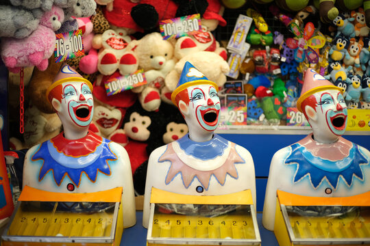 Laughing clowns game at fairground booth