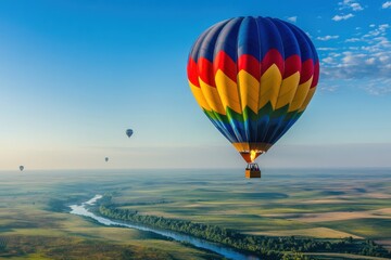 Obraz premium Colorful Balloon Over Scenic Earth Landscape