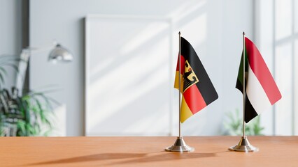 FLAGS OF GERMANY AND SUDAN ON TABLE