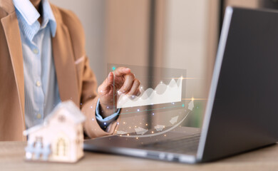 businessman points out,graph rising, about real estate Financial success,and growth, of a business, rising wealth,and economic progress, stocks, funds, and more sales, currency exchange rate concept.