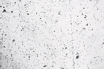 Obraz premium lightly textured concrete wall with faint speckled black spots and soft uneven surfaces creating a minimalistic abstract look 