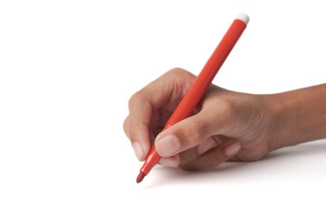 hand holding red felt tip or fiber tip pen isolated white background, writing, drawing or sketching, side view with copy space