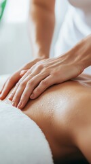 Naklejka premium A professional masseuse performing a deep tissue massage in a modern spa, with the client lying comfortably on the table
