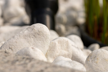 Close-up white marble pebbles in a bed