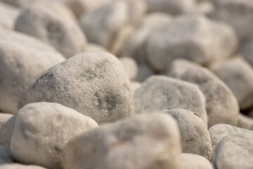 Close-up white marble pebbles in a bed