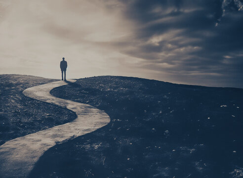 Lone figure on foggy and unknown path -personal journey, decisions, life uncertainties