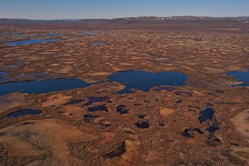 Fototapeta premium Aerial view of palsa mires at Ferdesmyra nature preserve in clear summer weather, Finnmark, Norway.