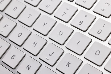 Wireless technology computer keyboard closeup view isolated on white background