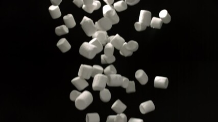 Fluffy White Marshmallows Dropping Gracefully In Slow Motion