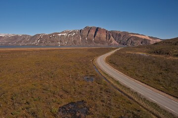Aerial view of Austertanaveien road 890 in clear summer weather, Varanger Peninsula, Norway.