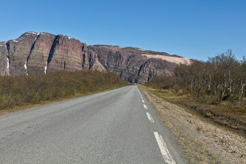 View of Austertanaveien road 890 in clear summer weather, Varanger Peninsula, Norway.