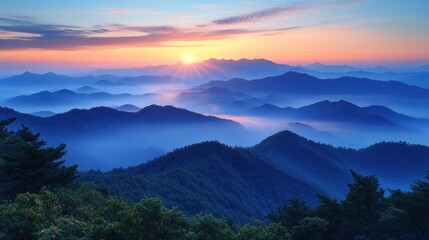 Obraz premium Serene sunrise over misty mountains, showcasing natural beauty.