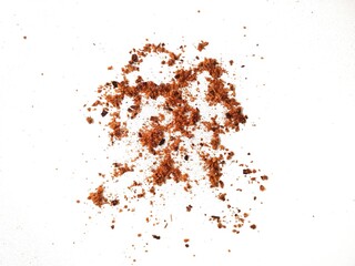 Scattered Boncabe Chili Powder on White Background.