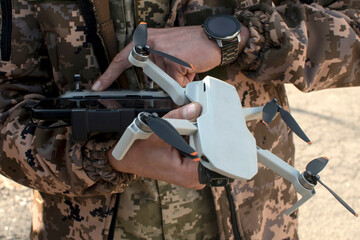Fototapeta premium Ukrainian soldier holding a drone