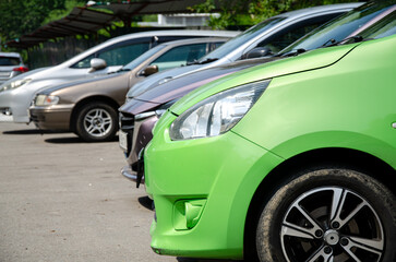Cars stand sideways on the road in summer
