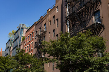 Row of Beautiful Apartment Buildings with fire escapes in Greenwich Village of New York City