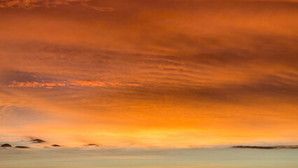 Fototapeta premium scarlet sunset in cloudy sky