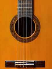 Obraz premium Close up of a guitar neck with a black fretboard. The fretboard has a black design with a few white lines. The neck is slightly curved and the fretboard is slightly raised