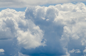 Many large clouds against the sky